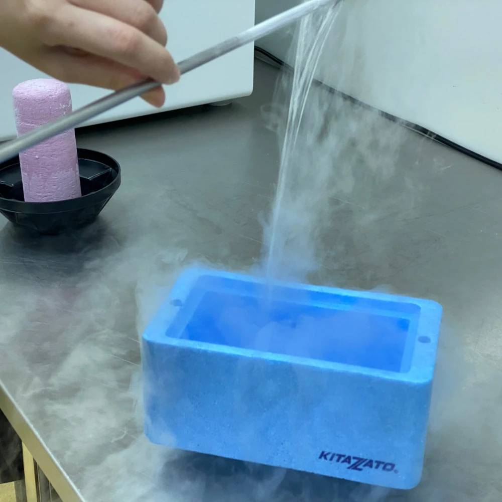 Embryologist at Sunfert IVF handling liquid nitrogen from cryostorage to freeze and preserve eggs, sperm, embryos, and ovarian tissue
